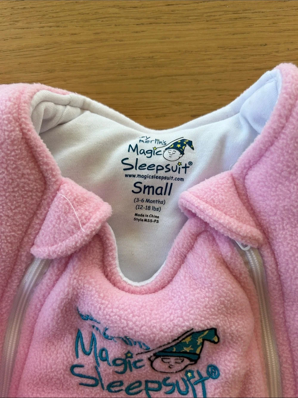 2 pink magic Merlin sleep suits size small 3-6m